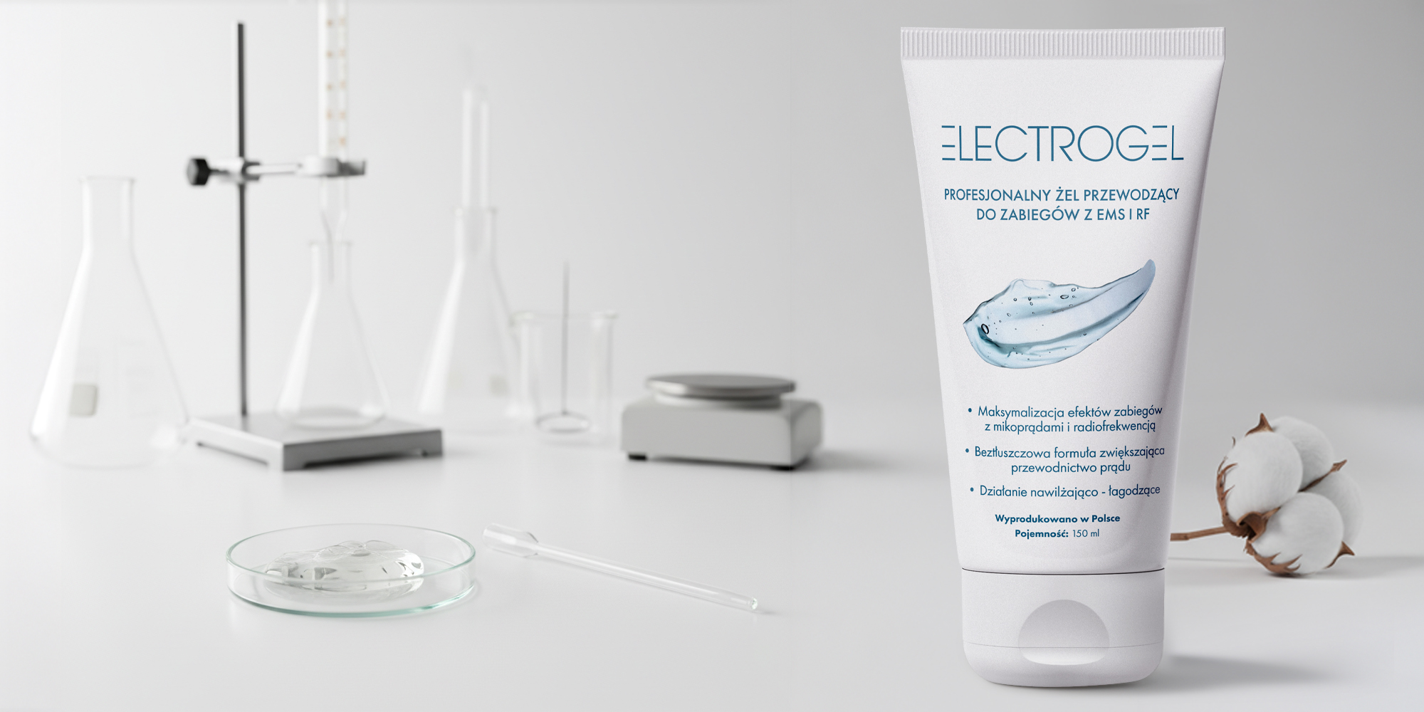 Żel przewodzący Humanas Electrogel - 150 ml, w tle laboratorium kosmetologiczne