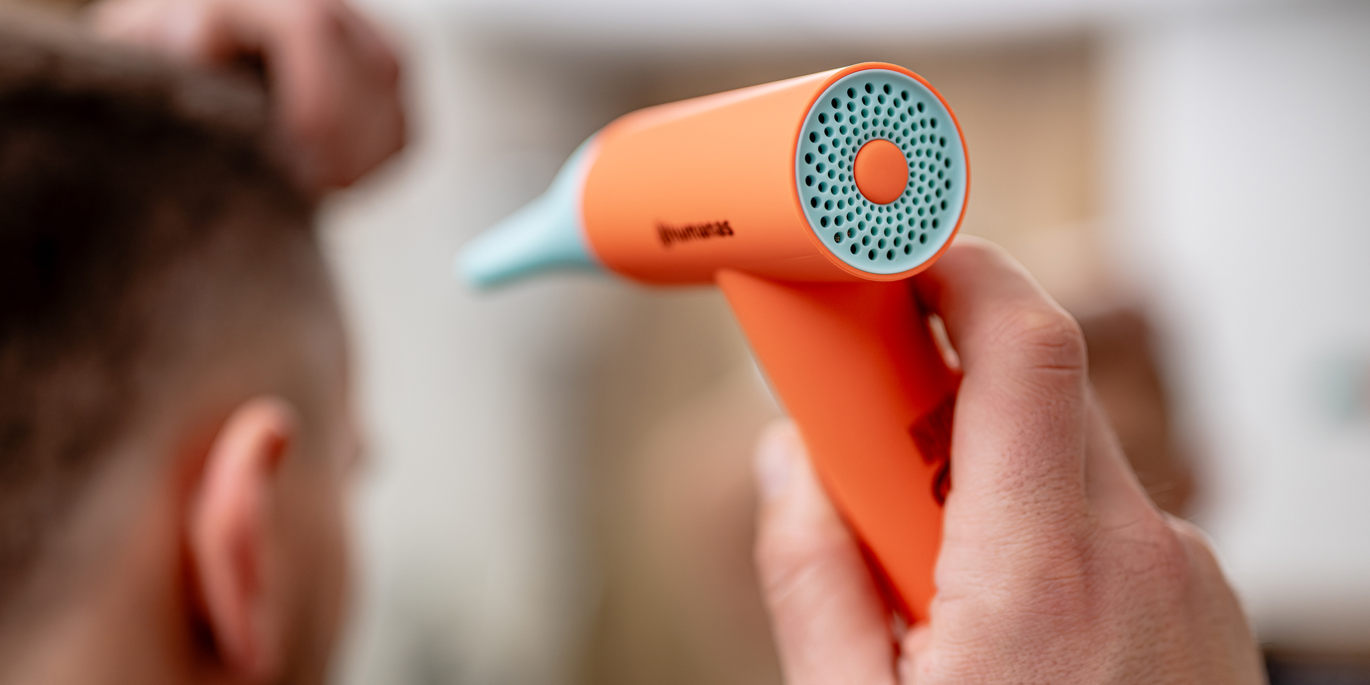 Suszarka do włosów z funkcją jonizowania Humanas AirTouch HD-AT03 mini - pomarańczowa